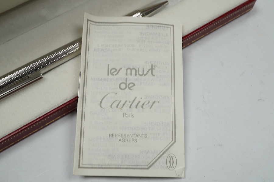 A Cartier pen, 14cm long, boxed. Condition - good